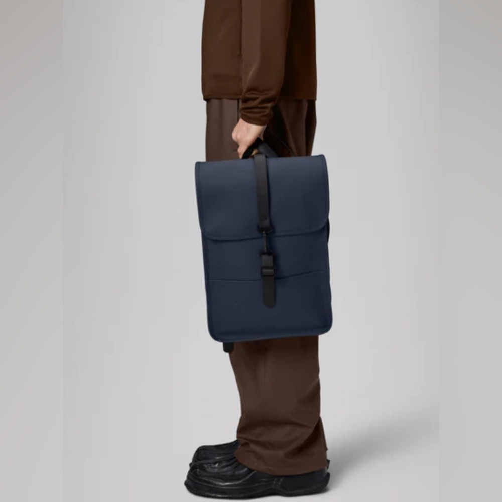 Brand new Rains navy backpack mini, 100% waterproof.